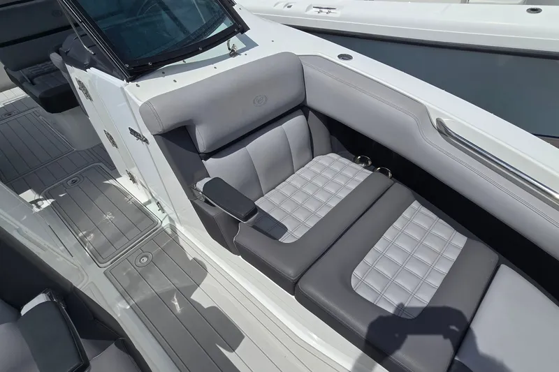 Slide: The Image of 2023 Cobalt 30SC Outboard boat interior with gray seating and sleek design. - 17