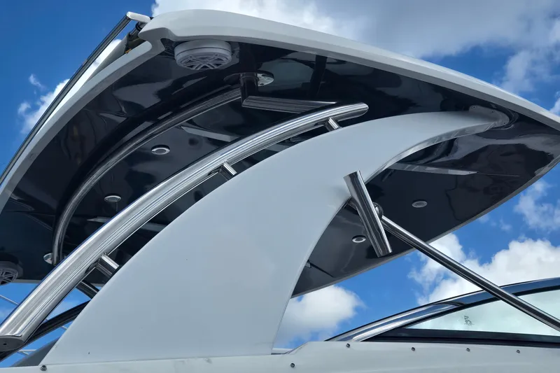 Slide: The Image of 2023 Cobalt 30SC Outboard boat with sleek design against a blue sky backdrop. - 18