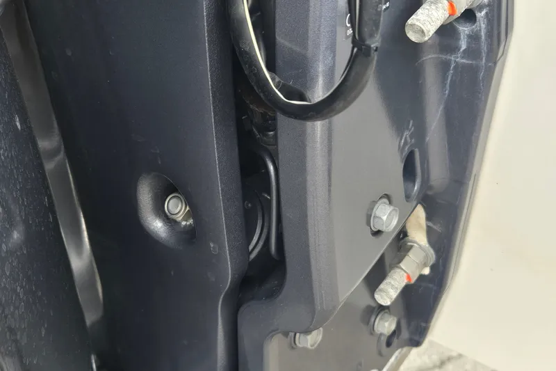 Slide: The Image of Close-up of 2023 Cobalt 30SC Outboard engine components and connections. - 23