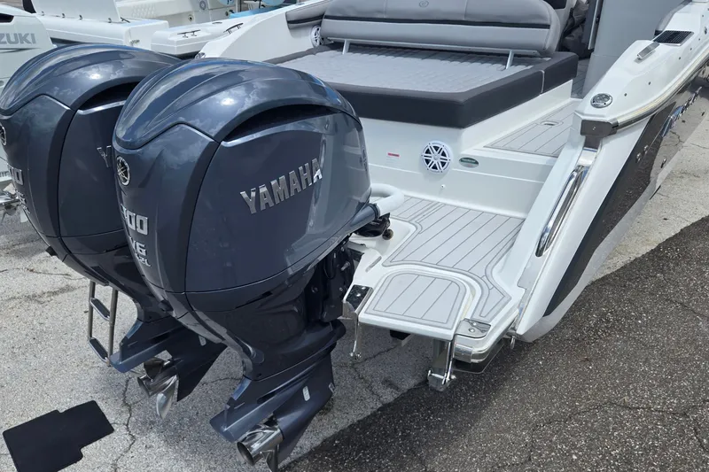 Slide: The Image of 2023 Cobalt 30SC Outboard boat with dual Yamaha engines on display. - 21