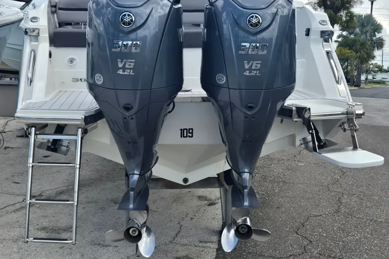 Slide: The Image of 2023 Cobalt 30SC Outboard with twin Yamaha 300 V6 engines, rear view. - 20