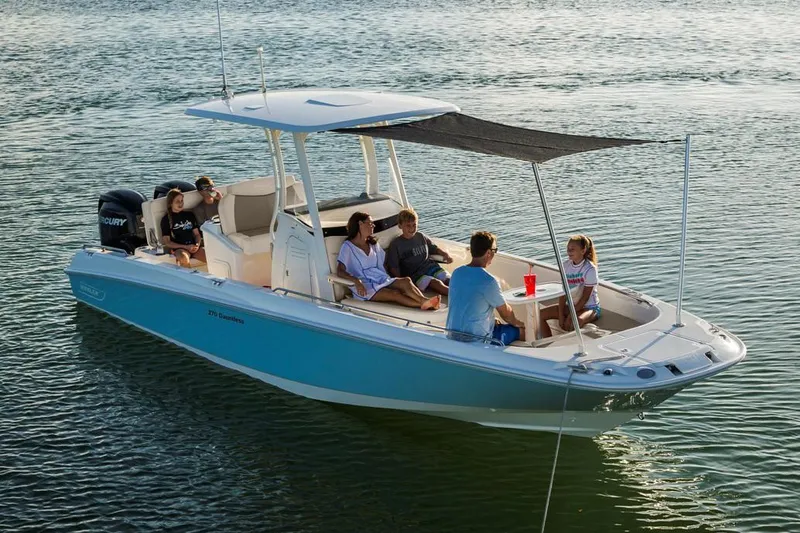 Slide: The Image of Manufacturer Provided Image: 2022 Boston Whaler 270 Dauntless boat with people relaxing on the water. - 36