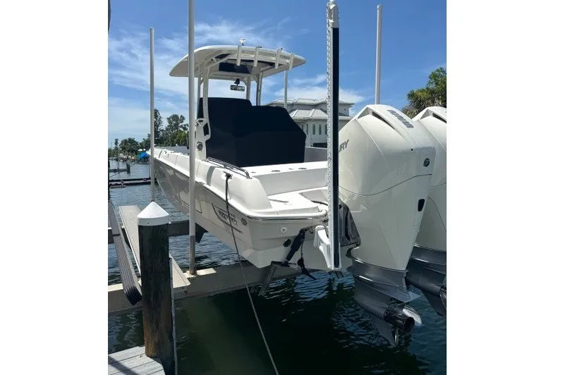 Slide: The Image of 2022 Boston Whaler 270 Dauntless boat docked with dual engines, sunny day. - 19