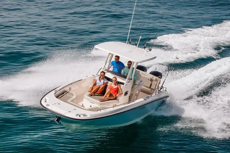 Slide: The Image of Manufacturer Provided Image: 2022 Boston Whaler 270 Dauntless boat cruising with passengers on open water. - 34
