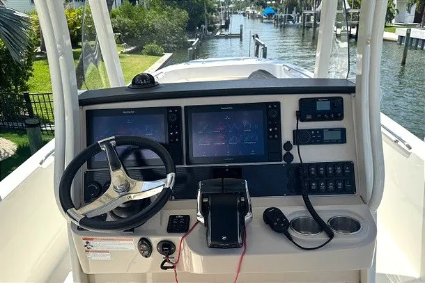 Slide: The Image of Cockpit of 2022 Boston Whaler 270 Dauntless with advanced navigation systems. - 2