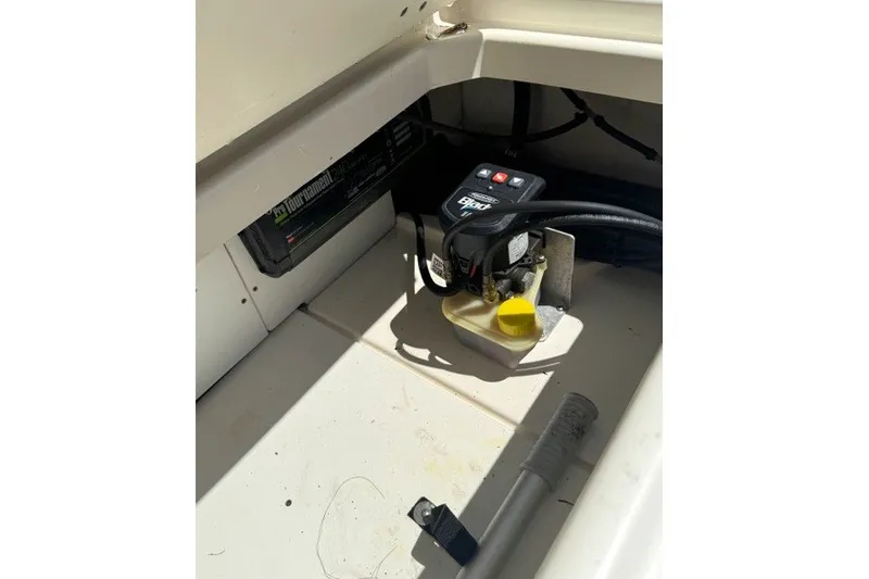 Slide: The Image of Interior view of a 2022 Boston Whaler 270 Dauntless boat compartment with equipment. - 30