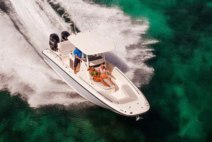 Slide: The Image of Manufacturer Provided Image: 2022 Boston Whaler 270 Dauntless cruising on clear turquoise waters. - 35