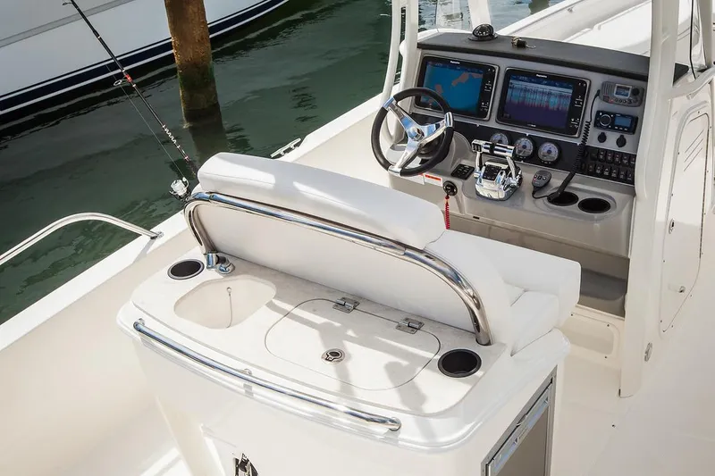Slide: The Image of Manufacturer Provided Image: 2022 Boston Whaler 270 Dauntless boat cockpit with modern controls and seating. - 8