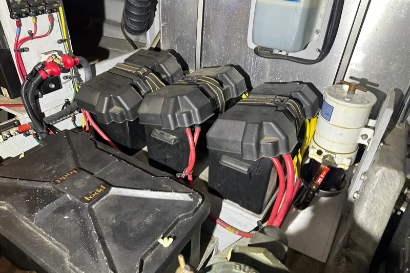 Slide: The Image of Engine room of a 2005 Silverton 43 Motor Yacht with battery setup and wiring. - 46