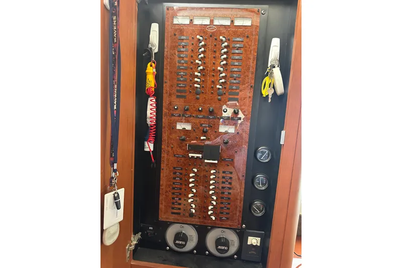 Slide: The Image of Electrical control panel of a 2005 Silverton 43 Motor Yacht with switches and gauges. - 39