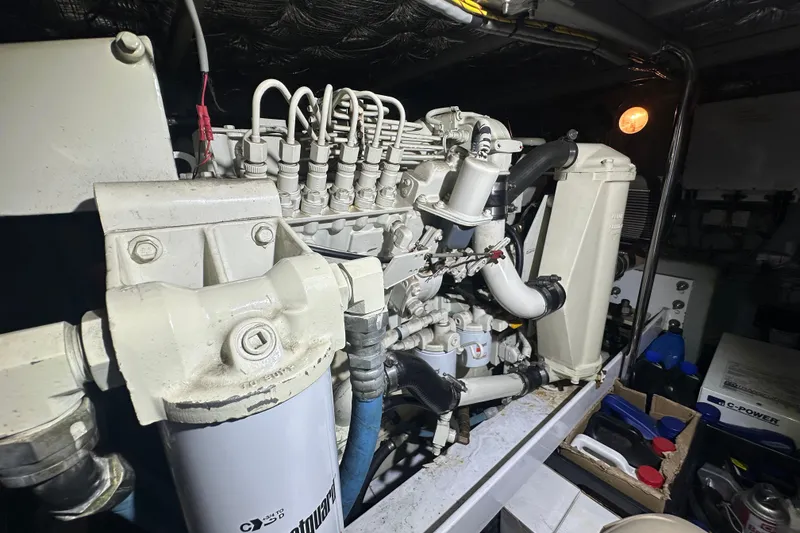 Slide: The Image of Engine room of a 2005 Silverton 43 Motor Yacht, showcasing mechanical components. - 42