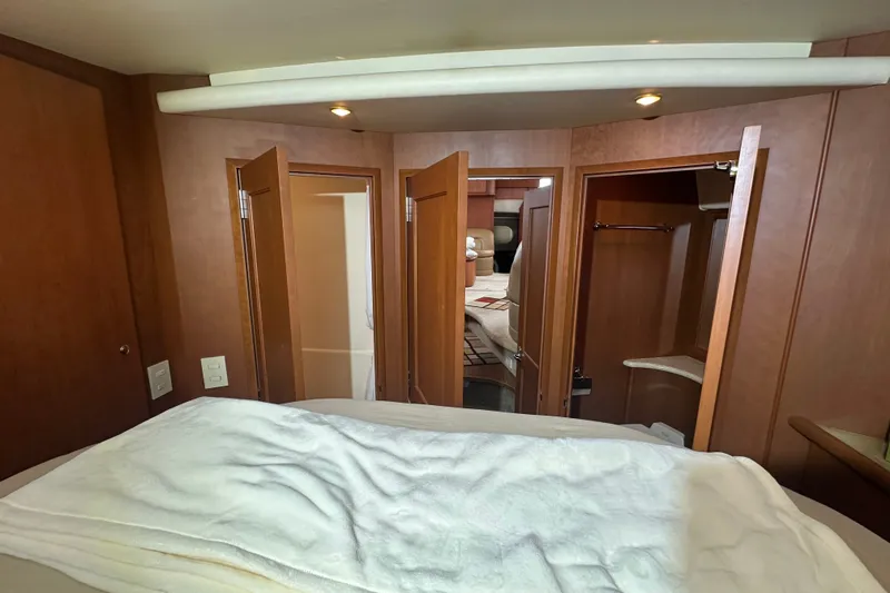 Slide: The Image of Interior of 2005 Silverton 43 Motor Yacht with wooden finishes and cozy cabin layout. - 38