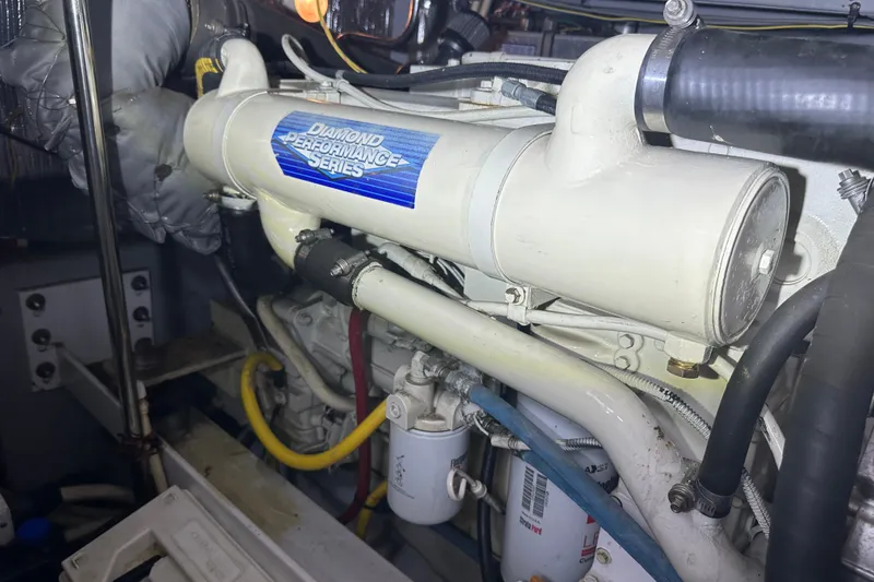 Slide: The Image of Engine compartment of a 2005 Silverton 43 Motor Yacht, featuring Diamond Performance Series components. - 41