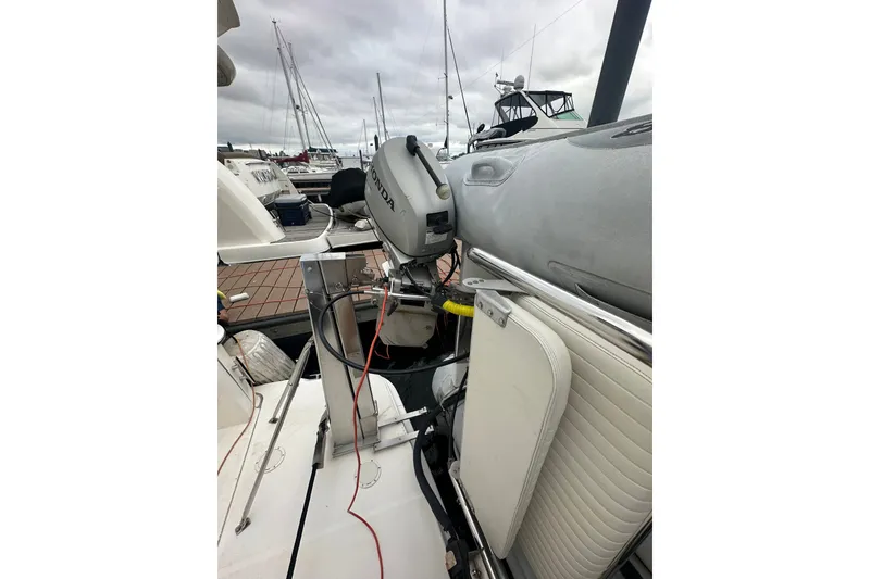 Slide: The Image of 2005 Silverton 43 Motor Yacht with Honda outboard motor at marina. - 49