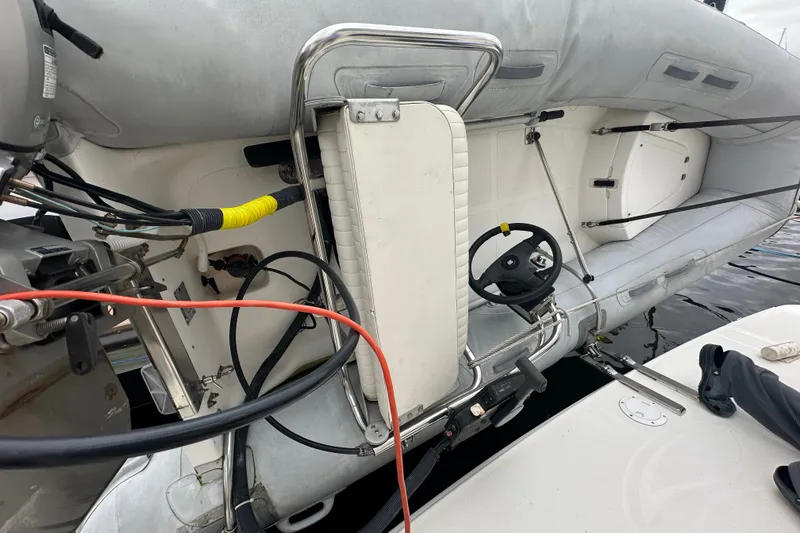 Slide: The Image of Inflatable boat attached to a 2005 Silverton 43 Motor Yacht, featuring steering controls. - 47