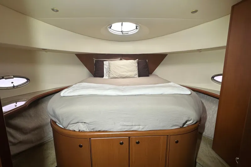 Slide: The Image of Luxurious bedroom interior of 2005 Silverton 43 Motor Yacht with circular bed and portholes. - 30