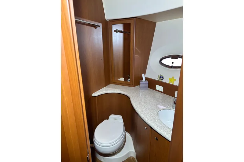 Slide: The Image of Bathroom interior of 2005 Silverton 43 Motor Yacht with wooden cabinetry and modern fixtures. - 35