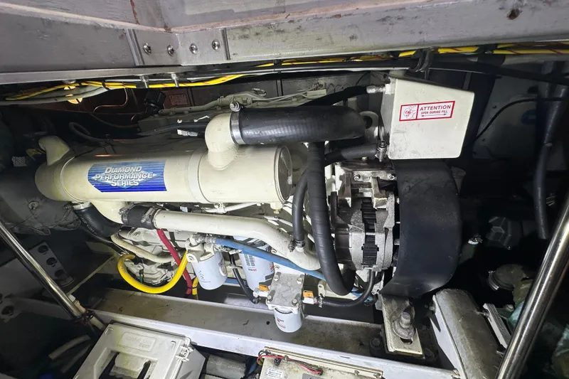 Slide: The Image of Engine room of a 2005 Silverton 43 Motor Yacht, featuring a Diamond Performance Series engine. - 44