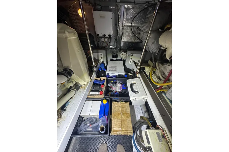 Slide: The Image of Engine room of a 2005 Silverton 43 Motor Yacht with various equipment and supplies. - 40