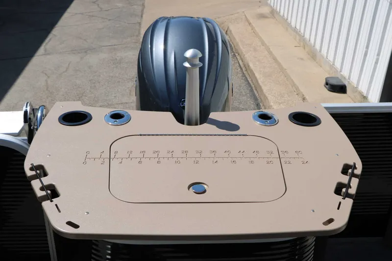 Slide: The Image of The image shows the stern of a Bennington 22 SF Tri Toon boat with an outboard motor. - 45