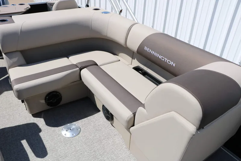 Slide: The Image of The image shows the seating area of a 2027 Bennington 22 SF Tri Toon with beige and brown upholstery. - 44