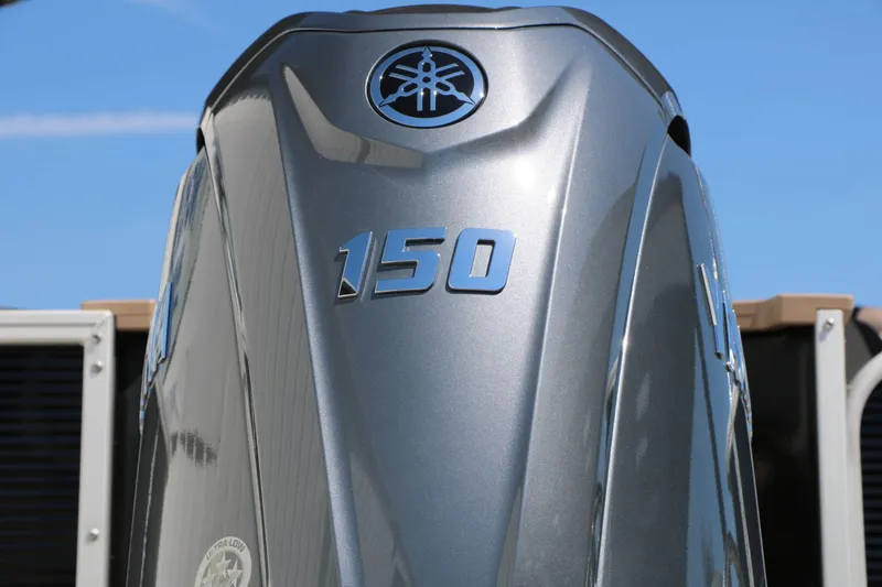 Slide: The Image of Close-up of a Yamaha 150 outboard motor on a boat. - 18
