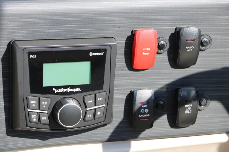 Slide: The Image of The image shows a control panel with a Rockford Fosgate radio and several switches. - 38