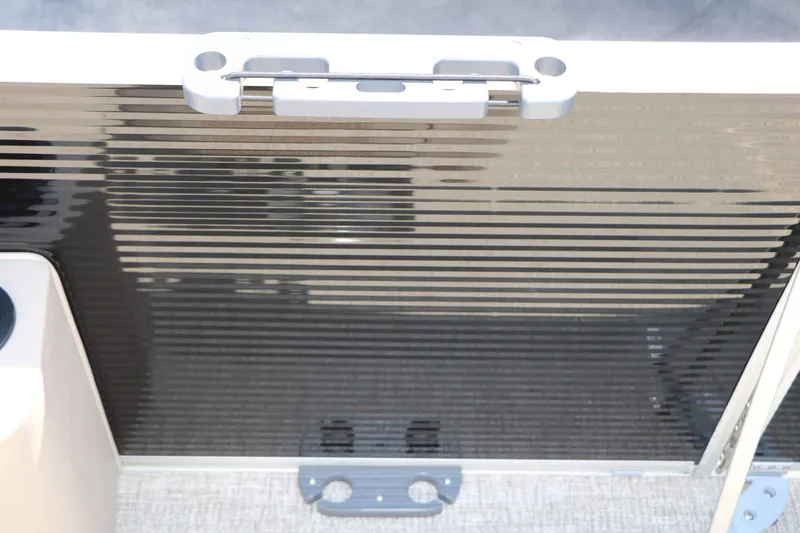 Slide: The Image of Close-up of a part of a 2027 Bennington 22 SF Tri Toon with a glossy surface. - 32