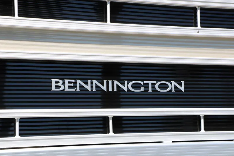 Slide: The Image of Close-up of the Bennington logo on a 2027 22 SF Tri Toon. - 23