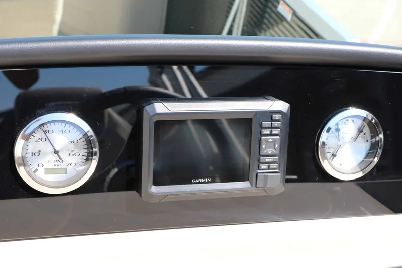 Slide: The Image of The image shows a dashboard with a Garmin screen and two analog gauges. - 39