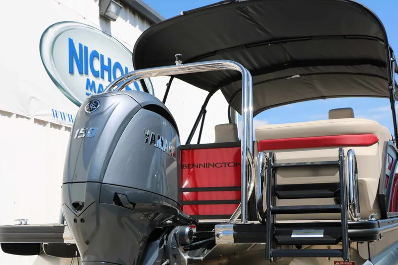 Slide: The Image of The image shows a Bennington 22 MFB Tri Toon boat with a Yamaha 150 engine and a black sunshade. - 17