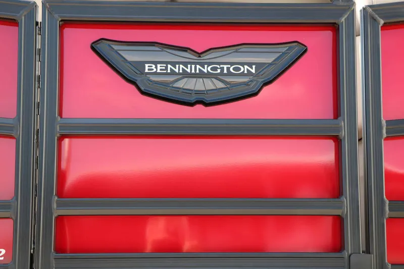 Slide: The Image of Close-up of the Bennington logo on a red background. - 11