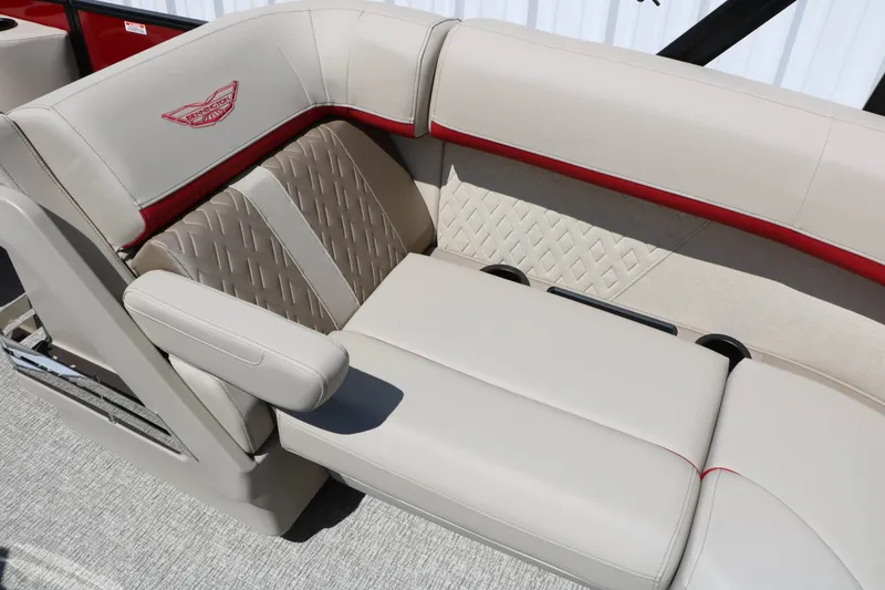 Slide: The Image of Luxurious beige seating with red accents and quilted pattern on a Bennington boat. - 37