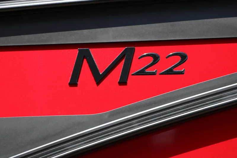 Slide: The Image of Close-up of a red hull on a Bennington 22 MFB Tri Toon with "M22" lettering. - 28
