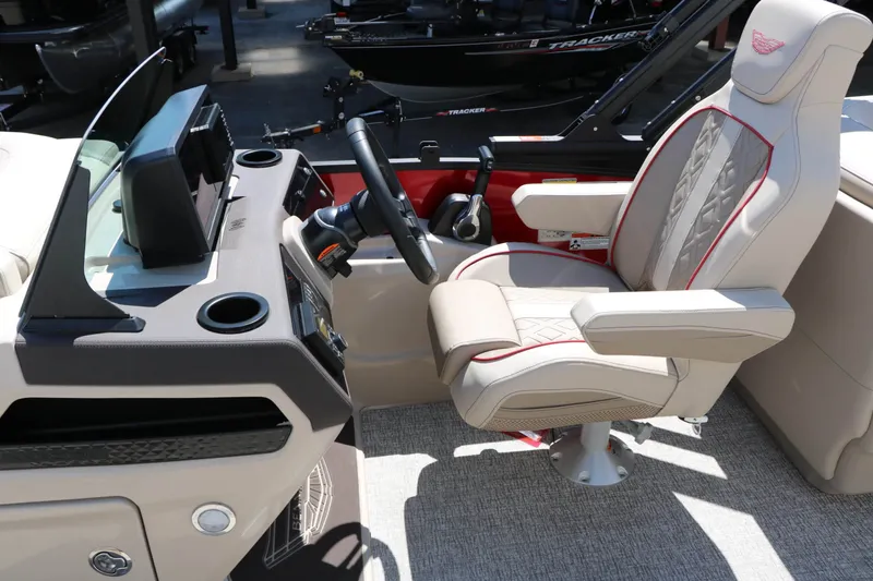 Slide: The Image of The image shows the helm of a 2027 Bennington 22 MFB Tri Toon with a sleek captain's chair. - 48