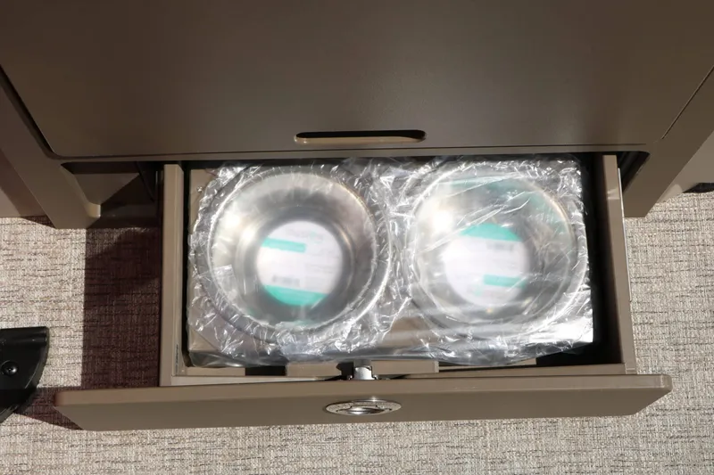 Slide: The Image of A drawer containing two stainless steel bowls in plastic wrap on a boat. - 42