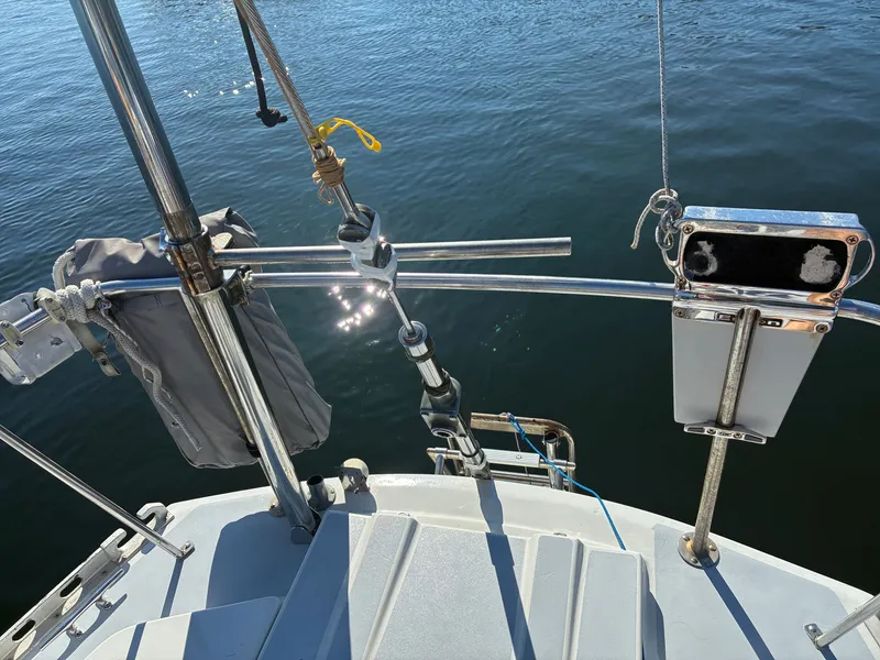 Slide: The Image of The image shows the stern of a 1973 Pearson 36 sailboat with shiny metal railings. - 18