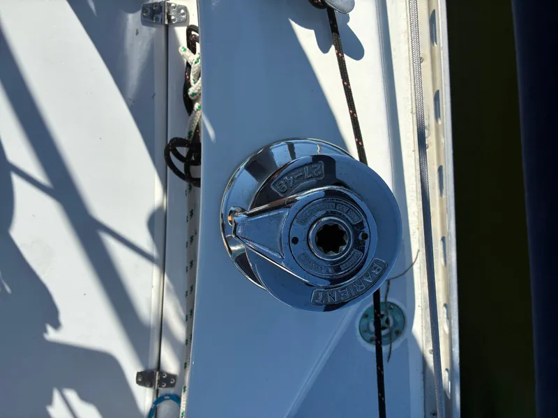 Slide: The Image of Close-up of a winch on a boat, surrounded by ropes and metal fittings. - 25