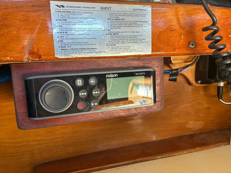 Slide: The Image of A Fusion MS-RA70 radio is mounted in a wooden frame, surrounded by operating instructions. - 39