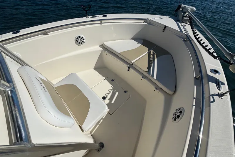 Slide: The Image of 2019 Bulls Bay 230 Center Console boat interior with cushioned seating and ocean view. - 9