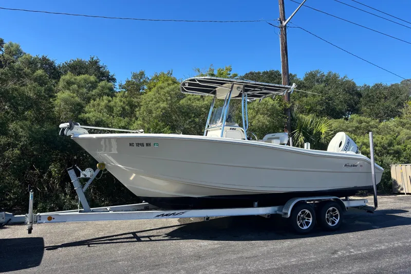 Slide: The Image of 2019 Bulls Bay 230 Center Console boat on trailer, parked outdoors. - 15