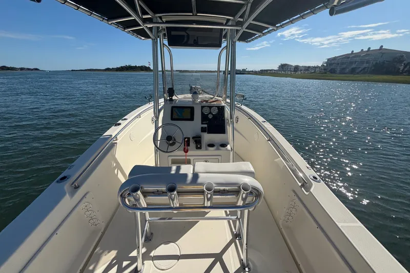 Slide: The Image of 2019 Bulls Bay 230 Center Console boat on calm water, featuring a sleek design and modern controls. - 12