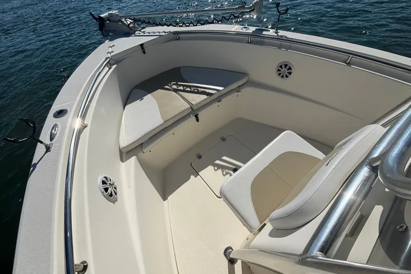 Slide: The Image of 2019 Bulls Bay 230 Center Console boat interior with seating and rod holders. - 8