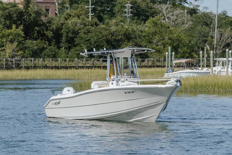 Slide: The Image of 2019 Bulls Bay 230 Center Console boat cruising on a serene waterway. - 7