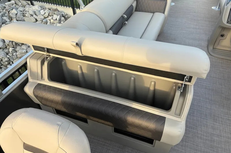 Slide: The Image of 2025 Sun Tracker Fishin' Barge 20 DLX boat seat with open storage compartment. - 13