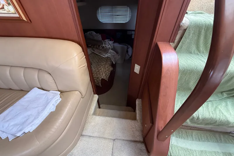 Slide: The Image of Interior view of 2004 Silverton 43 Motor Yacht, featuring stairs and seating area. - 138
