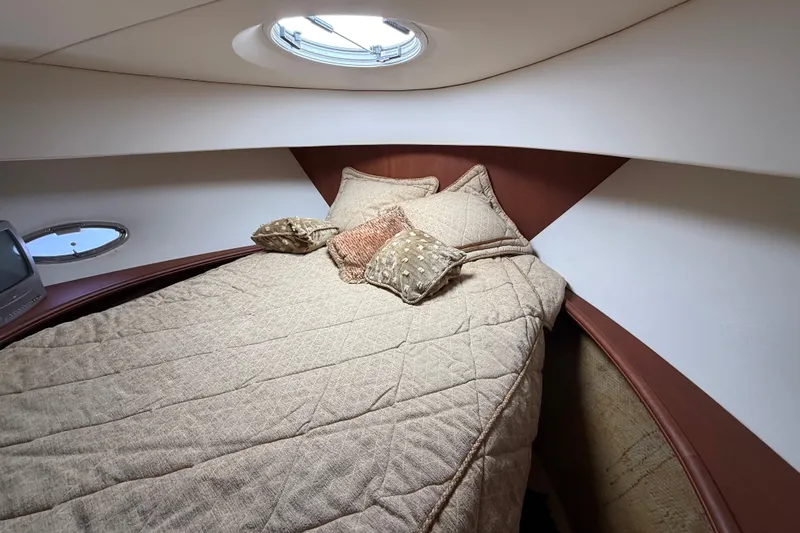 Slide: The Image of Luxurious cabin interior of 2004 Silverton 43 Motor Yacht with cozy bedding. - 129