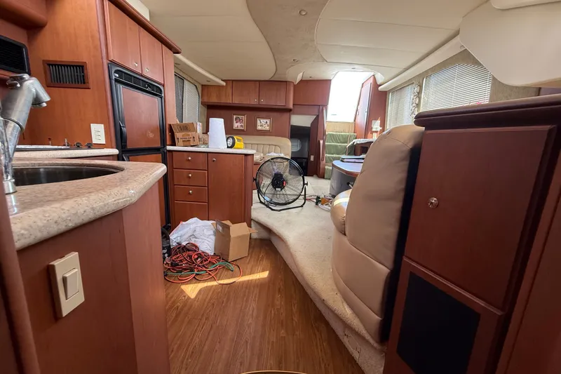 Slide: The Image of Interior of a 2004 Silverton 43 Motor Yacht with wooden cabinetry and modern amenities. - 132
