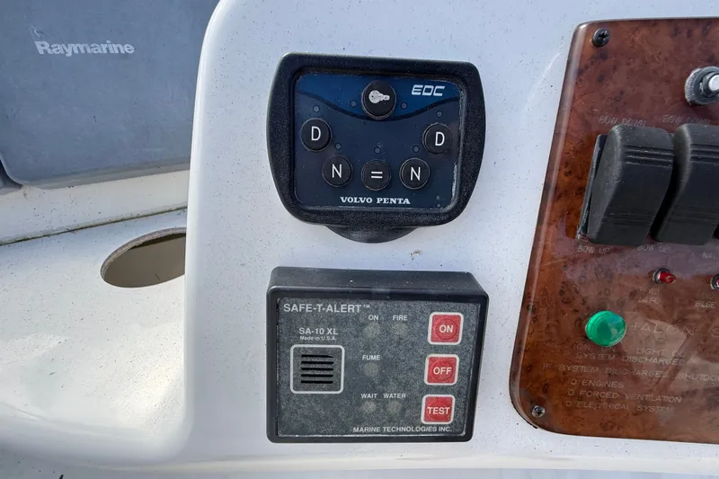 Slide: The Image of Control panel of a 2004 Silverton 43 Motor Yacht featuring Volvo Penta and Safe-T-Alert systems. - 34
