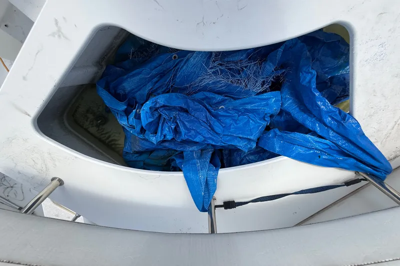 Slide: The Image of Blue tarp stored in a compartment of a 2004 Silverton 43 Motor Yacht. - 22